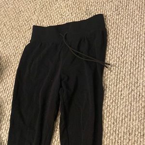 black sweatpants, drawstring.